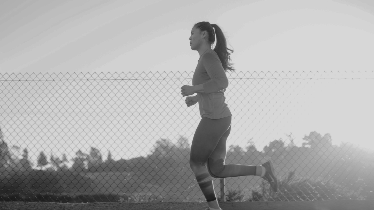 woman running while dealing with pelvic floor concerns