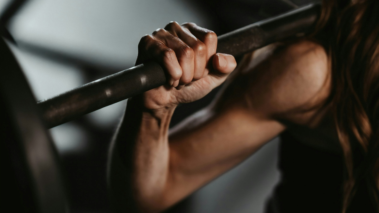 woman lifting weights in a gym