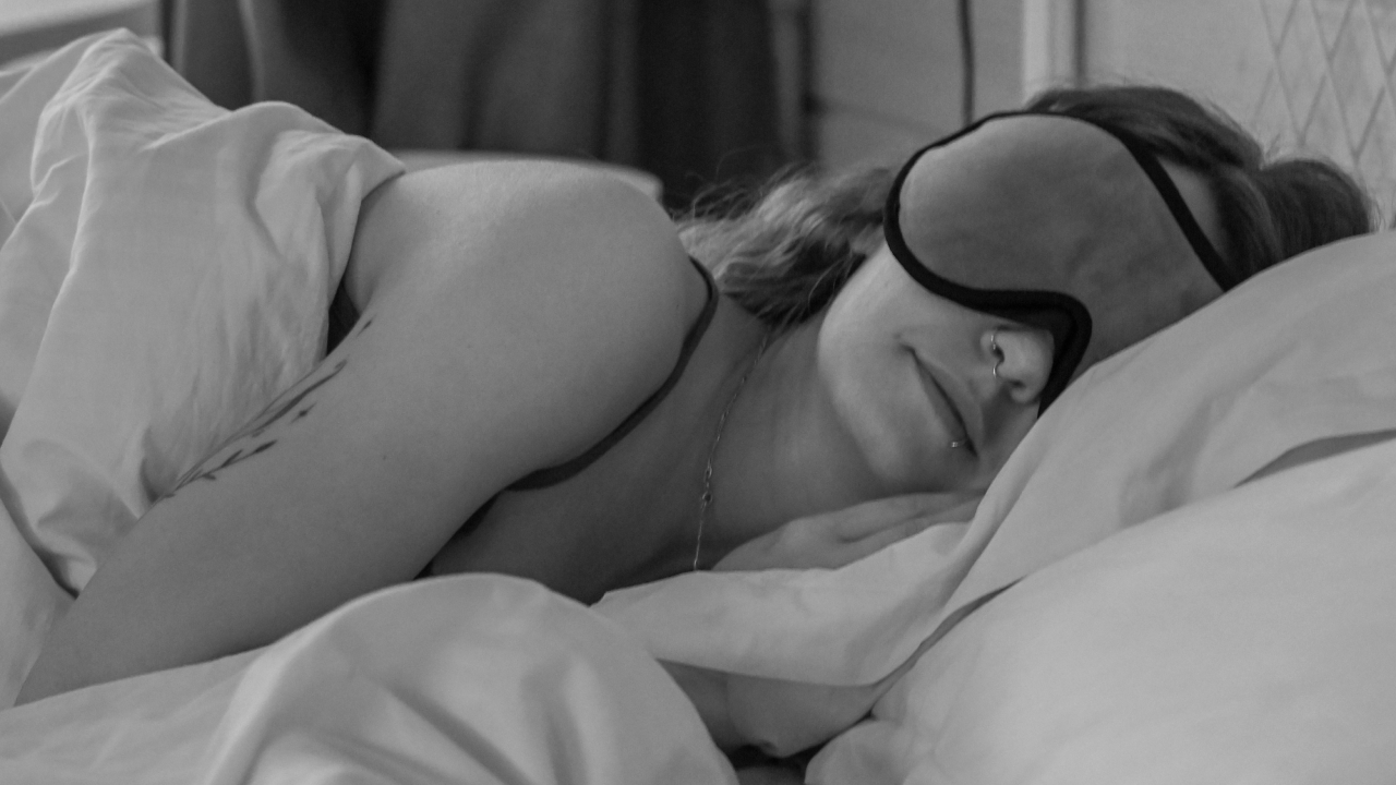 woman sleeping with an eye mask on