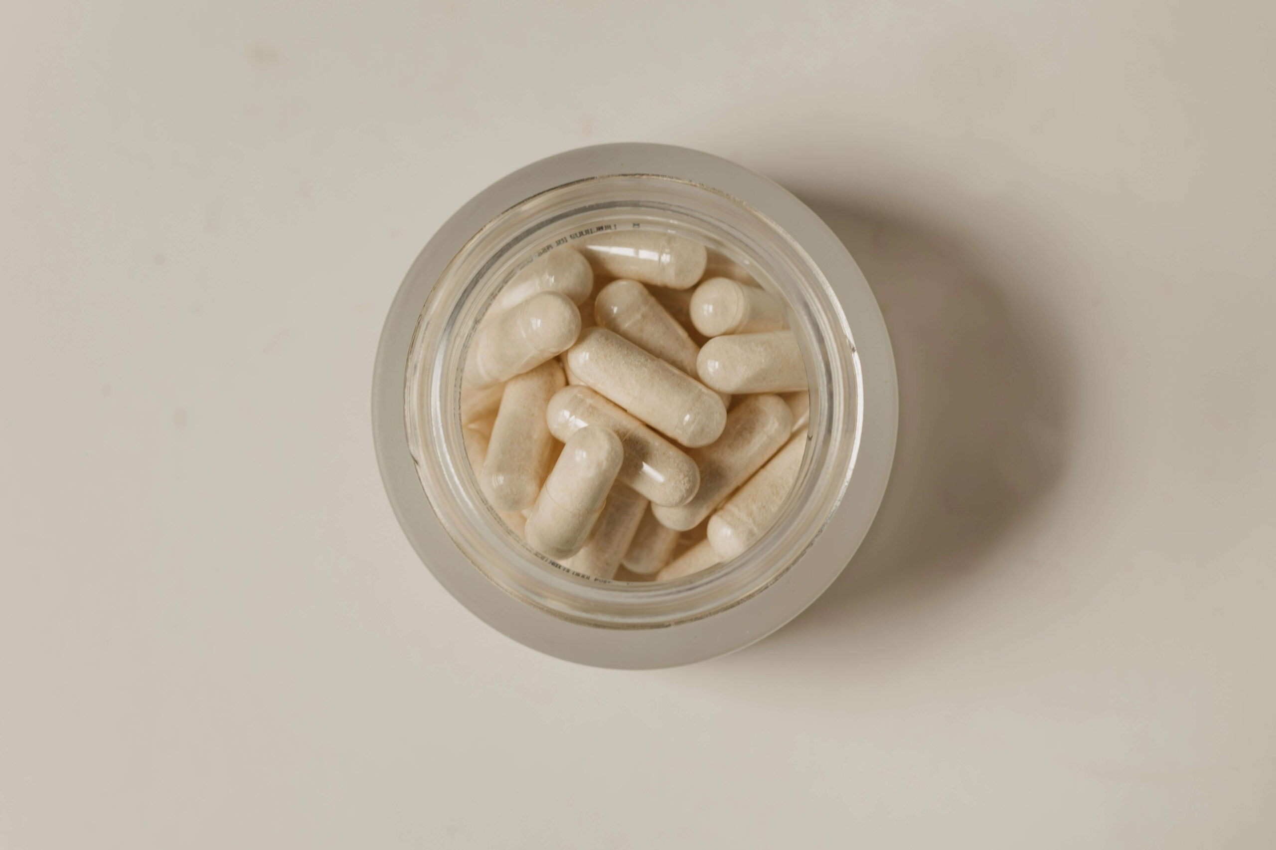 Magnesium supplement pills in a clear jar